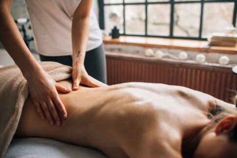 A soothing massage session in a warm indoor setting promoting relaxation and self-care.