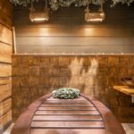 Cozy rustic sauna interior featuring wooden accents and natural decor for ultimate relaxation.